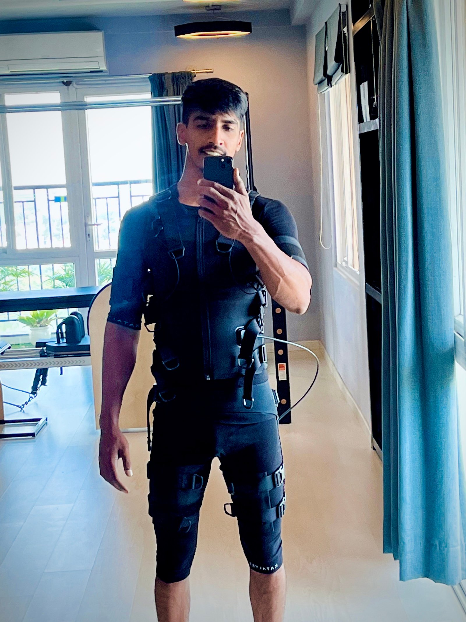 Syed Masood wearing an EMS suit
